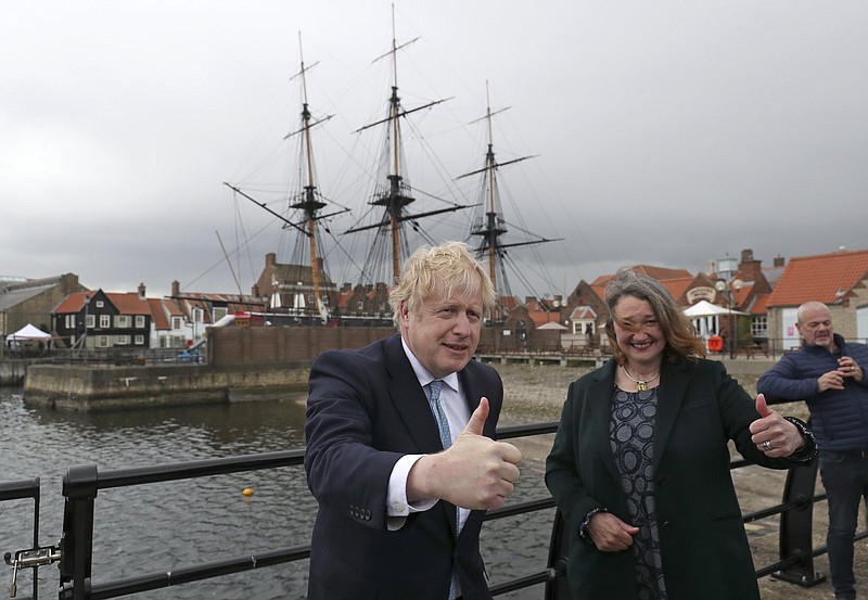 British Prime Minister Boris Johnson stands Friday next to Jill Mortimer, the winning Conservative Party candidate of the Hartlepool election in northeast England. More photos at arkansasonline.com/58ukpolls/.
(AP/Scott Heppell)