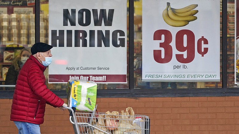 FILE - In this Friday, Jan. 8, 2021 file photo, A man walks out of a Marc's Store in Mayfield Heights, Ohio. (AP/Tony Dejak, File)