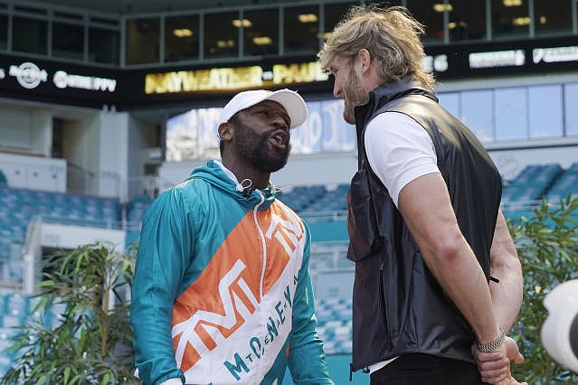 Boxers Floyd Mayweather and Logan Paul taunt each other during a news conference last Thursday in Miami Gardens, Fla. Mayweather and Paul are scheduled to face off in an exhibition bout June 6. (AP Photo/Marta Lavandier)