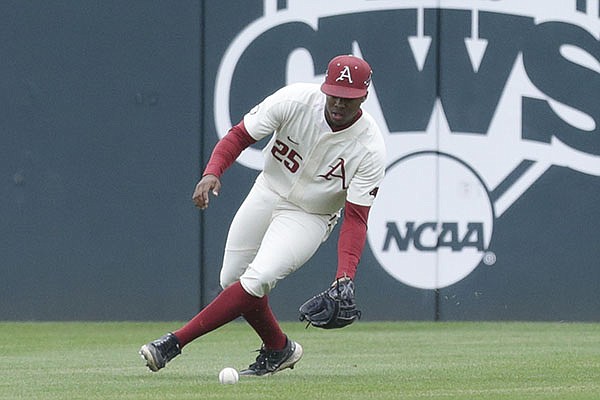 Arkansas center fielder Christian Franklin fields a ball during a game against Georgia on Sunday, May 9, 2021, in Fayetteville.