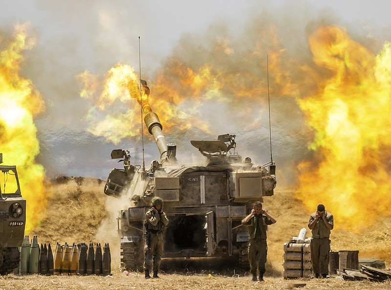 An Israeli artillery unit on the Israel-Gaza border fires toward targets Wednesday in the Gaza Strip. The shelling followed an intense barrage of airstrikes just after sunrise across Gaza. Meanwhile, Gaza militants continued to bombard Israel with rocket fire throughout the day.
(AP/Yonatan Sindel)