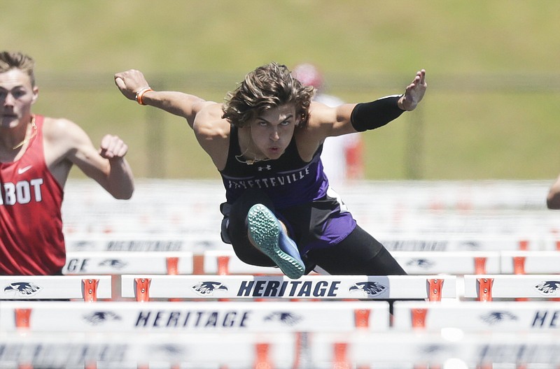 FILE -- Fayetteville's Sam Hurley runs the 110 meter hurdles, Thursday, May 6, 2021 during the 6A State track and field meet at Heritage High School in Rogers. 
(NWA Democrat-Gazette/Charlie Kaijo)