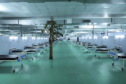 A tree stands Wednesday in a facility normally used for large political rallies in New Delhi but that has now been set up with 500 ICU beds for covid-19 patients.
(AP/Amit Sharma)