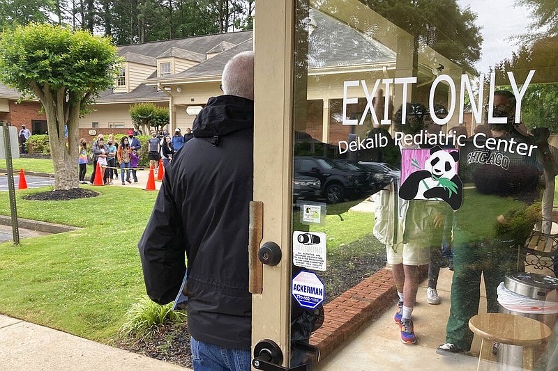 Children ages 12 to 15 wait to get vaccinated at a relapse pediatric center in Decatur, Ga., on Wednesday, May 12, 2021. (AP/Ravi Nessman)