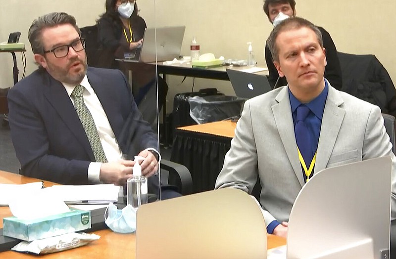 FILE - In this April 19, 2021, file image from video, defense attorney Eric Nelson, left, and defendant, former Minneapolis police officer Derek Chauvin, speak to Hennepin County Judge Peter Cahill after the judge has put the trial into the hands of the jury' in the trial of Chauvin, in the May 25, 2020, death of George Floyd at the Hennepin County Courthouse in Minneapolis, Minn. (Court TV via AP, Pool File)