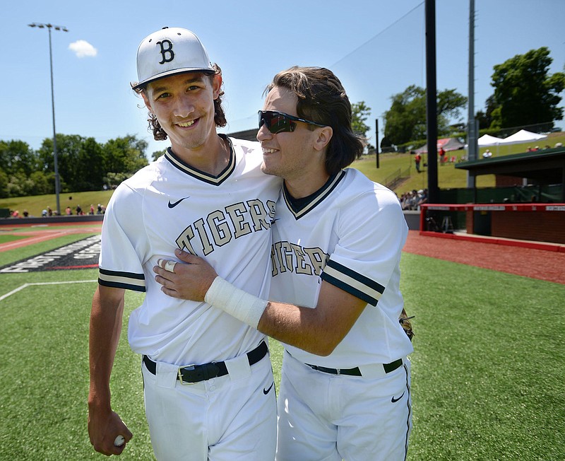Bentonville pitcher Tyrus Riley (left) is congratulated by catcher Joseph Hardin after the Tigers’ 4-0 victory over Fort Smith Northside in the Class 6A state baseball tournament at Hunts Park in Fort Smith. Riley threw a complete-game, one-hit shutout and was 3 for 4 at the plate. More photos at arkansasonline.com/514boys6a1/.
(NWA Democrat-Gazette/Andy Shupe)