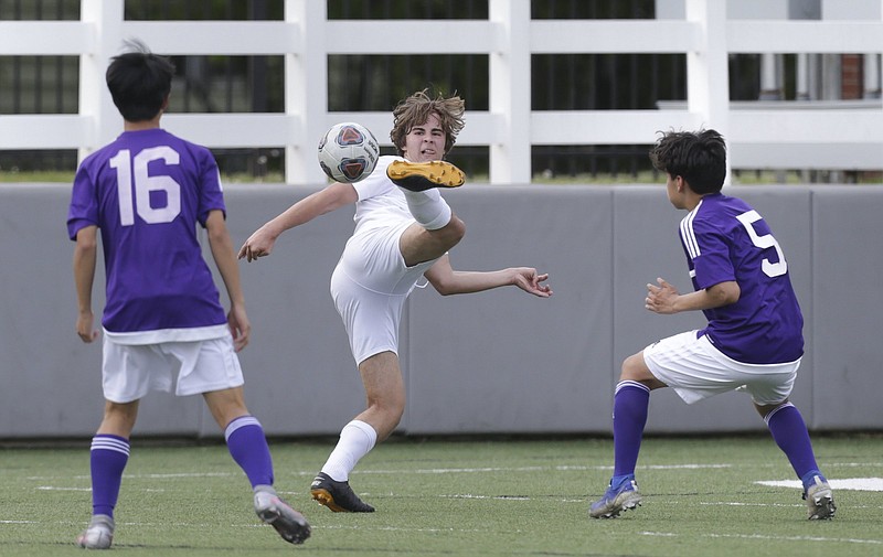 Bentonville West midfielder Stefan Gerlei scored both of the Wolverines’ goals in Thursday’s victory over Little Rock Catholic in the Class 6A boys soccer state tournament.
(NWA Democrat-Gazette/Charlie Kaijo)