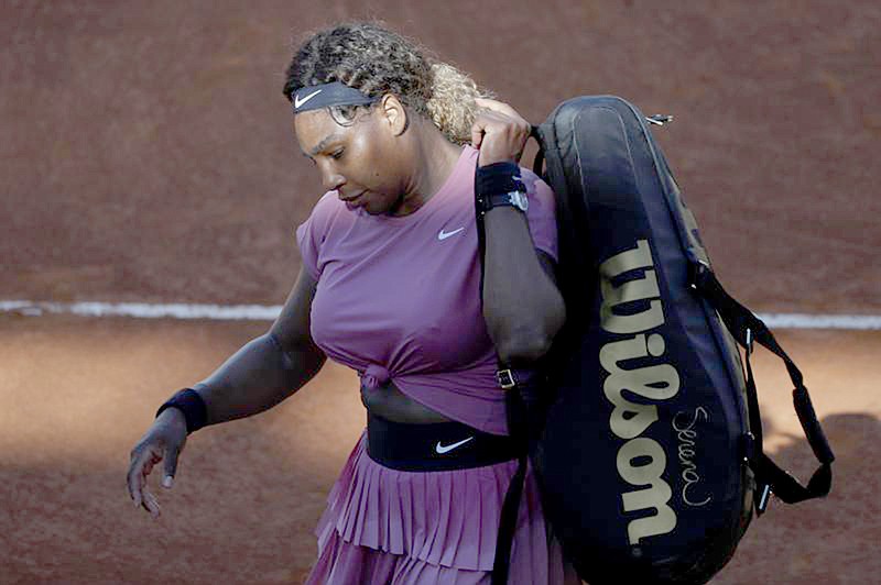 Serena Williams, of the United States, leaves the court at the end of her match against Nadia Podoroska of Argentina, at the Italian Open tennis tournament, in Rome, Wednesday, May 12, 2021. Podoroska beat Williams 7-6, 7-5. (AP Photo/Alessandra Tarantino)
