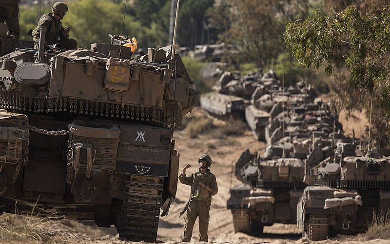 Israeli ground forces take positions Friday along the Gaza Strip border, as artillery bombarded the Gaza Strip throughout the day. Israel reported that 160 warplanes had dropped 80 tons of explosives over the course of 40 minutes.
(New York Times/Dan Balilty)