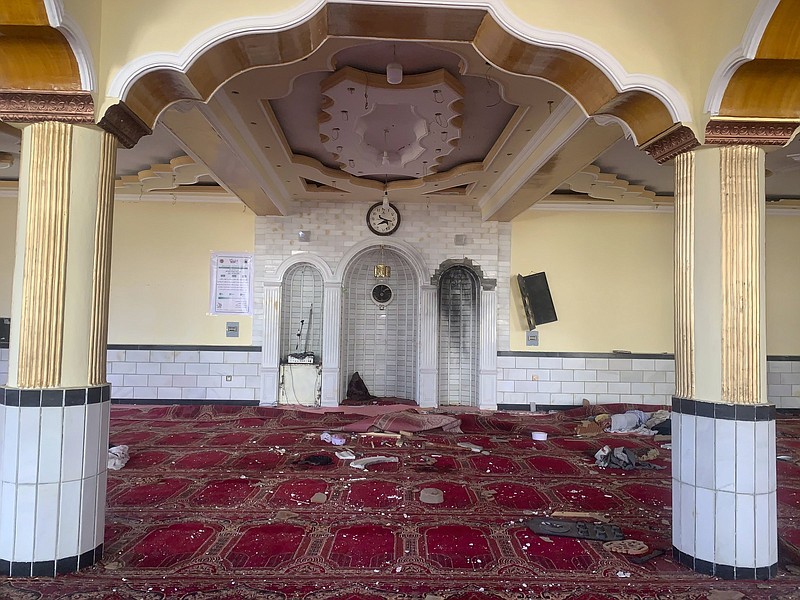 Debris covers the floor of a mosque in the Shakar Dara district of Kabul on Friday after a bomb exploded during prayers.
(AP/Rahmat Gul)