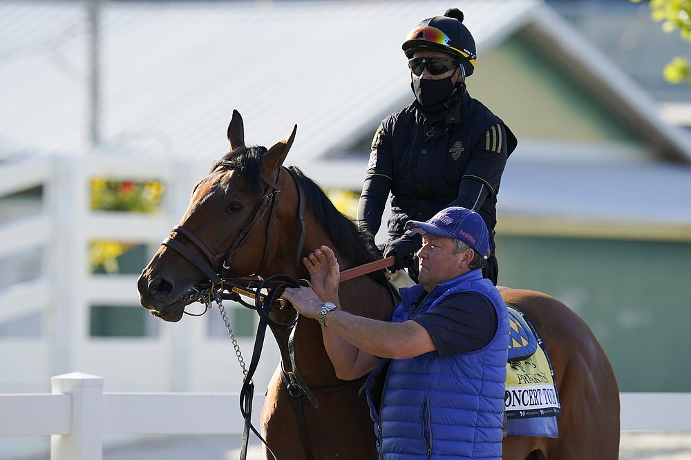 Concert Tour is walked to the track for a morning exercise Tuesday at Pimlico Race Course in Baltimore. Concert Tour was the 5-2 second choice in the morning-line odds.
(AP/Julio Cortez)