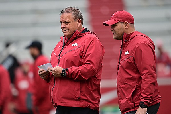 Arkansas football head coach Sam Pittman (left) and defensive coordinator Barry Odom are shown during the Razorbacks' Red-White spring game Saturday, April 17, 2021, in Fayetteville.
