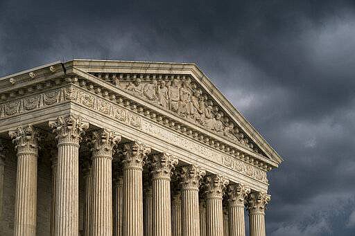 In file photo, the Supreme Court is seen in Washington as a storm rolls in.