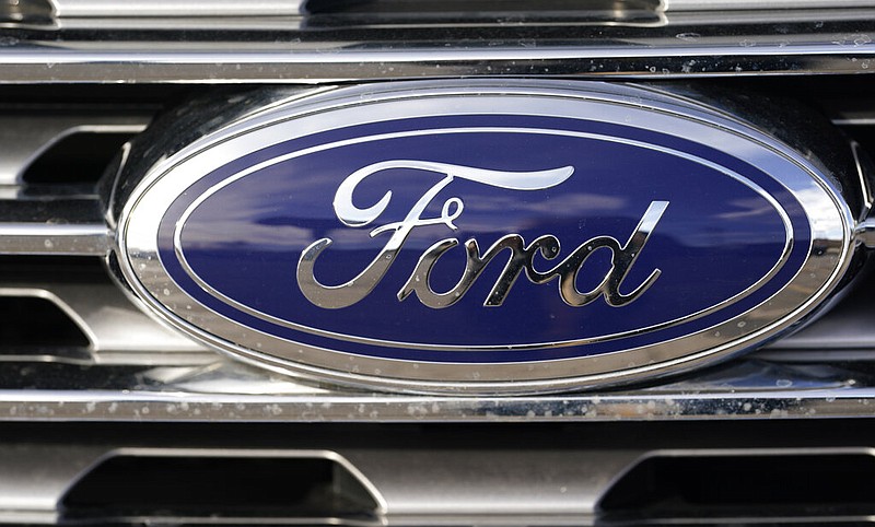 The blue oval logo of the Ford Motor Company is shown in east Denver in this April 25, 2021, file photo. (AP/David Zalubowski)