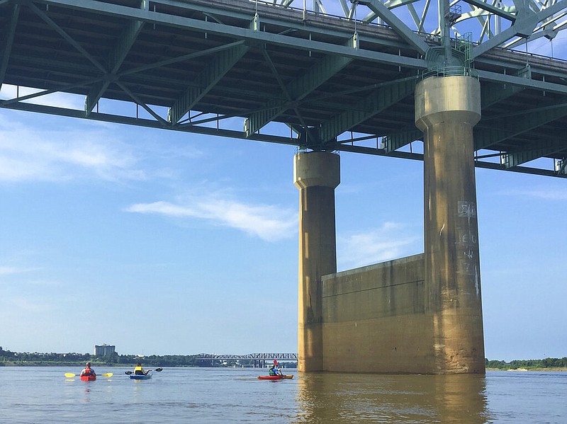 In this 2016 photo provided by Barry W. Moore, a cracked beam is visible directly above the kayaker on the right as the group floats the Mississippi River beneath the Interstate 40 bridge near Memphis. Officials have not confirmed that the crack was there at the time.
(AP/Barry W. Moore)
