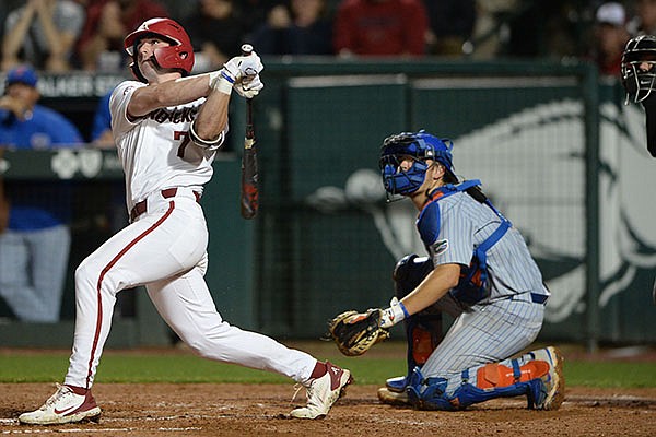 Arkansas right fielder Cayden Wallace hits his second home run of a game against Florida on Thursday, May 20, 2021, in Fayetteville.
