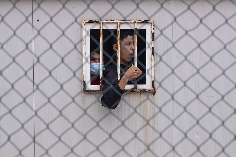 Children who crossed into Spain wait Thursday inside a temporary shelter for unaccompanied minors in the enclave of Ceuta, next to the border of Morocco and Spain.
(AP/Bernat Armangue)
