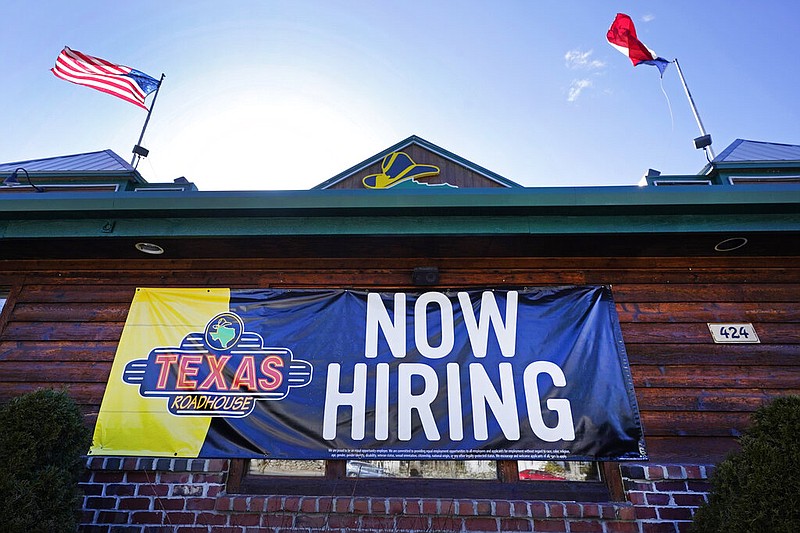 A restaurant in Methuen, Mass., displays a "Now Hiring" sign in this March 4, 2021, file photo. (AP/Elise Amendola)