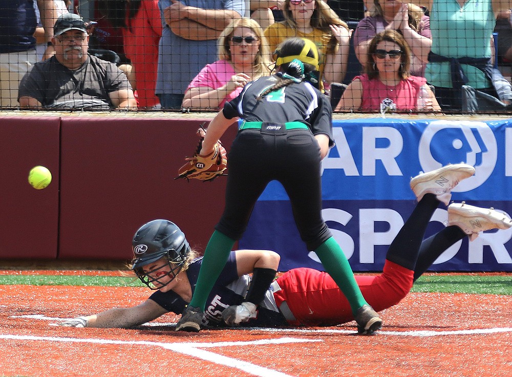 Baptist Prep’s Karis Turner slides home past Hoxie pitcher Ashten Wallace during the fifth inning of the Lady Eagles’ 9-1 victory over Hoxie in the Class 3A state championship game Saturday.
(Arkansas Democrat-Gazette/Thomas Metthe)