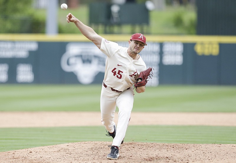 Arkansas Kevin Kopps (45) throws, Sunday, May 9, 2021 during the fifth inning of a baseball game at Baum-Walker Stadium in Fayetteville. Check out nwaonline.com/210510Daily/ for today's photo gallery. .(NWA Democrat-Gazette/Charlie Kaijo)