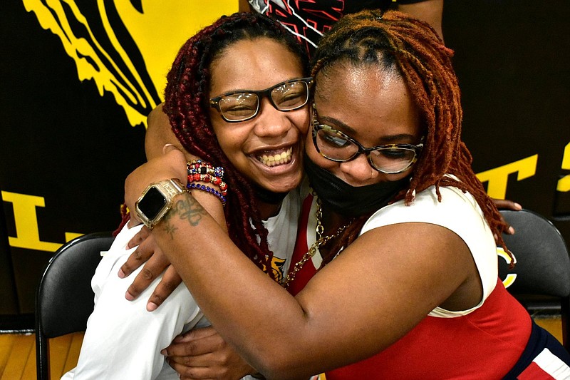 Watson Chapel graduate Dekeira Kentle (left) is embraced by her mother, Lakendrah Kentle, after signing with National Park College on Wednesday at Leslie Henderson Gymnasium. 
(Pine Bluff Commercial/I.C. Murrell)
