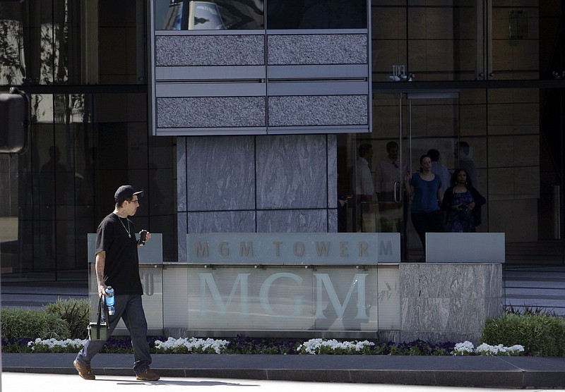 A man passes an entrance to the MGM corporate headquarters building in the Century City district of Los Angeles in this file photo. E-commerce giant Amazon said Wednesday that it plans to buy the 97-year-old film and television studio for $8.45 billion.
(AP)