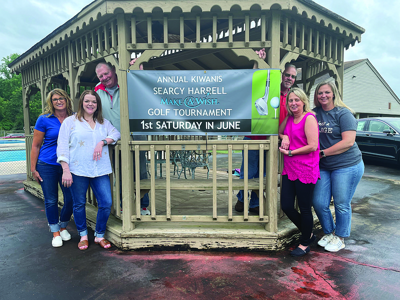 Members of the Camden Kiwanis Club pose next to the Searcy Harrell Memorial banner at the Camden Country Club. Pictured from left is Krissy Bassetti, Mylinda Simpson, Jim Dick Coleman, Duane Wilbur, Tara Wright and Jana Garcia. (Patric Flannigan/Camden News)