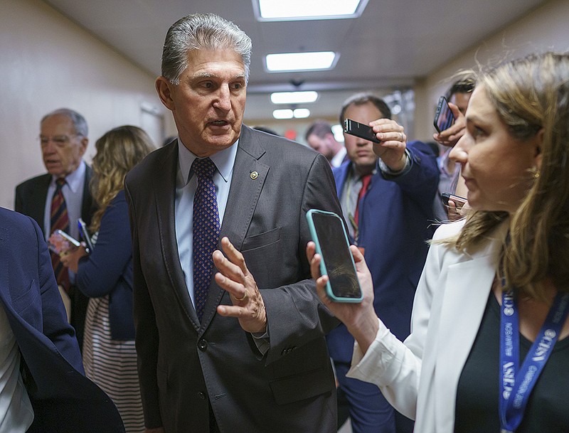 Sen. Joe Manchin heads to the Senate chamber Thursday for a series of votes. He lashed out at Senate Republicans who oppose the independent commission on the Jan. 6 insurrection at the Capitol but continues to oppose ending the filibuster process.
(AP/J. Scott Applewhite)