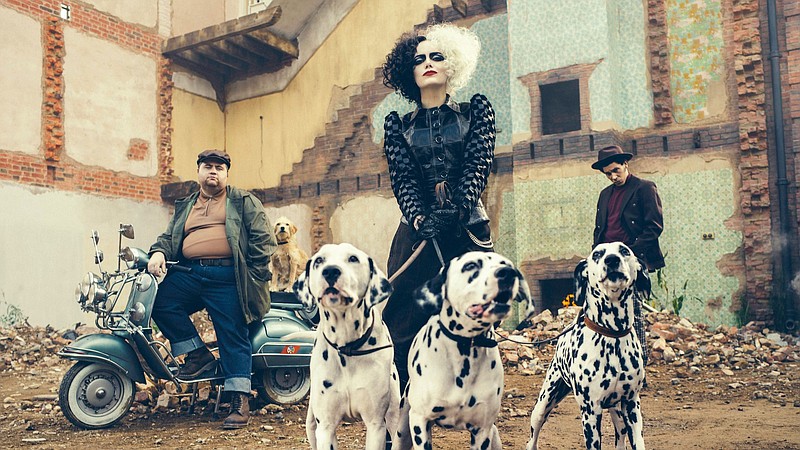 Sympathetic baddies Horace (Paul Walter Hauser), Cruella (Emma Stone) and Jasper (Joel Fry) alongside the real stars of “Cruella,” the dalmations that may or may not be digitally composed.