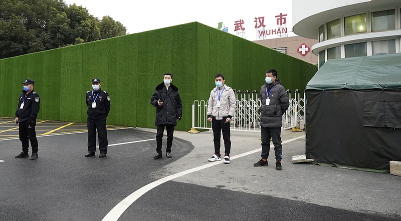Security personnel guard an entrance to the Wuhan Jinyintan Hospital in central China's Hubei province in this Jan. 30, 2021, file photo. A team from the World Health Organization visited the site in Wuhan as part of the investigation into the origins of the coronavirus that causes covid-19. (AP/Ng Han Guan)