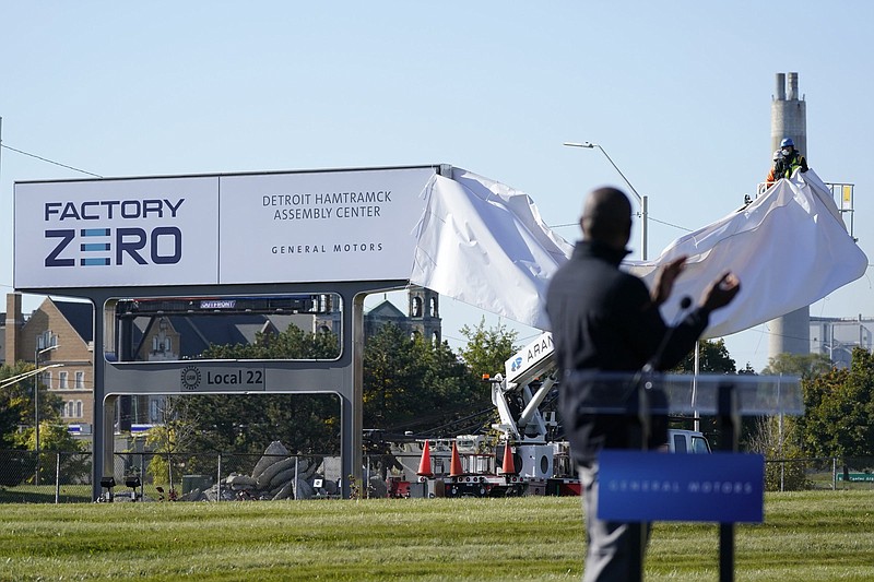 A new sign is unveiled in October at the General Motors Detroit-Hamtramck plant in Hamtramck, Mich. GM said that it will restart four North American plants that it closed because of a shortage of computer chips.
(AP)