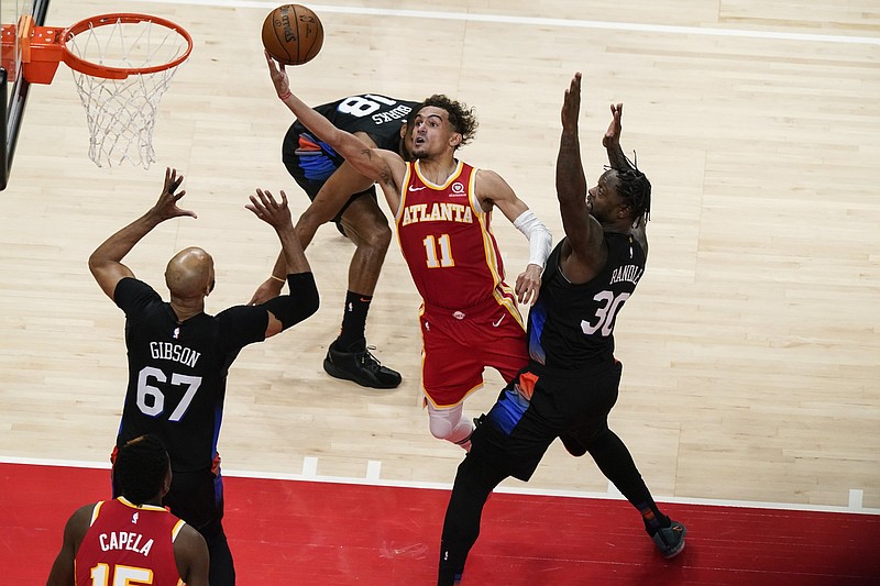Trae Young (11) finished with 21 points and 14 assists to lead the Atlanta Hawks past the New York Knicks on Friday in Game 3 of their NBA Eastern Conference playoff series.
(AP/Brynn Anderson)