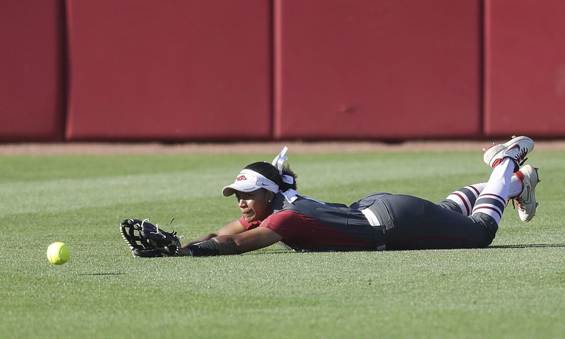 Arkansas center fielder Ryan Jackson falls short of making a catch on a fly ball during the Razorbacks’ loss to Arizona on Friday in Game 1 of the NCAA Fayetteville Super Regional at Bogle Park. Arkansas will face elimination today in the second game of the best-of-three series. More photos available at arkansasonline.com/529azua.
(NWA Democrat-Gazette/Charlie Kaijo)