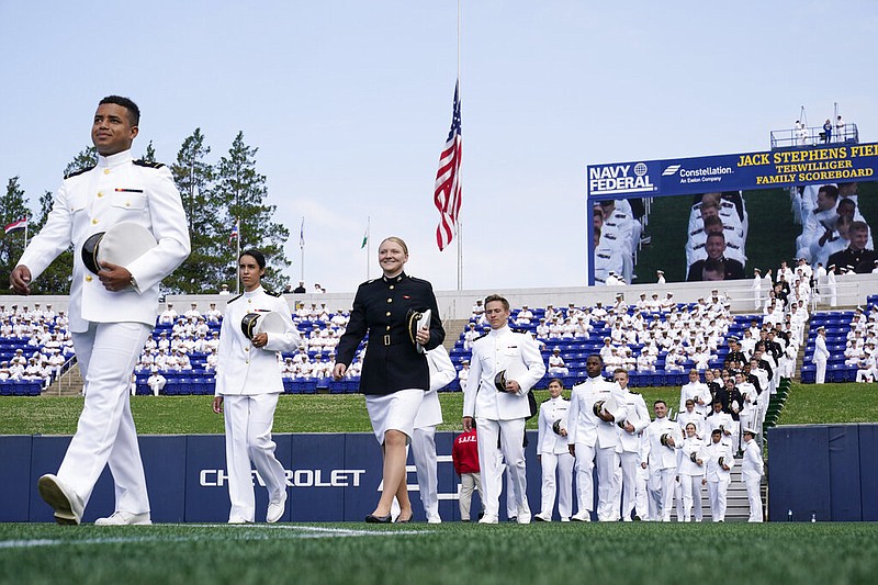 Members of the U.S. Naval Academy senior class arrive to take their seats at the graduation and commission ceremony at the U.S. Naval Academy in Annapolis, Md., on Friday, May 28, 2021. (AP/Susan Walsh)