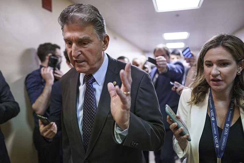 Sen. Joe Manchin, D-W.Va., a crucial 50th vote for Democrats on President Joe Biden’s proposals, walks with reporters as senators go to the chamber for votes ahead of the approaching Memorial Day recess, at the Capitol in Washington, Thursday, May 27, 2021. Senate Republicans are ready to deploy the filibuster to block a commission on the Jan. 6 insurrection, shattering chances for a bipartisan probe of the deadly assault on the U.S. Capitol and reviving pressure to do away with the procedural tactic that critics say has lost its purpose. (AP Photo/J. Scott Applewhite)