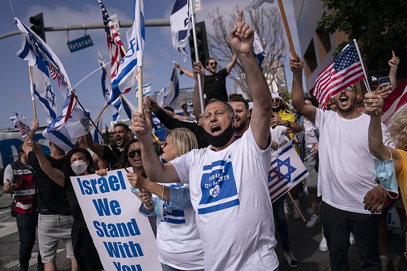 Pro-Israel supporters chant slogans during a rally in support of Israel outside the Federal Building in Los Angeles on May 12. A larger debate is playing out nationwide among many U.S. Jews who are divided over how to respond to the violence and over the disputed boundaries for acceptable criticism of Israeli policies.
(AP/Jae C. Hong)