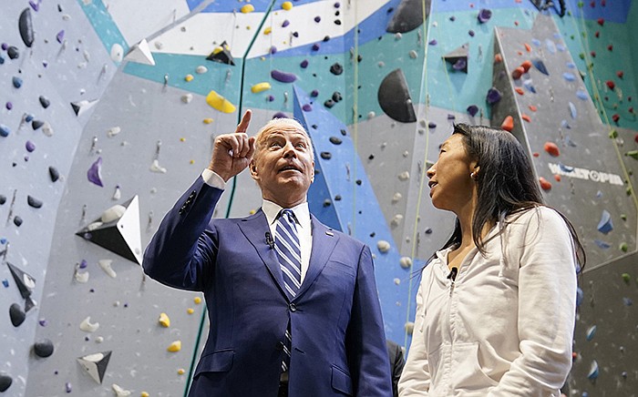 President Joe Biden talks with Lillian Chao-Quinlan, president of Sportrock Climbing Centers, during a tour of the center Friday in Alexandria, Va., as he praised those who have been vaccinated against the coronavirus for helping get the country open again.
(AP/Evan Vucci)