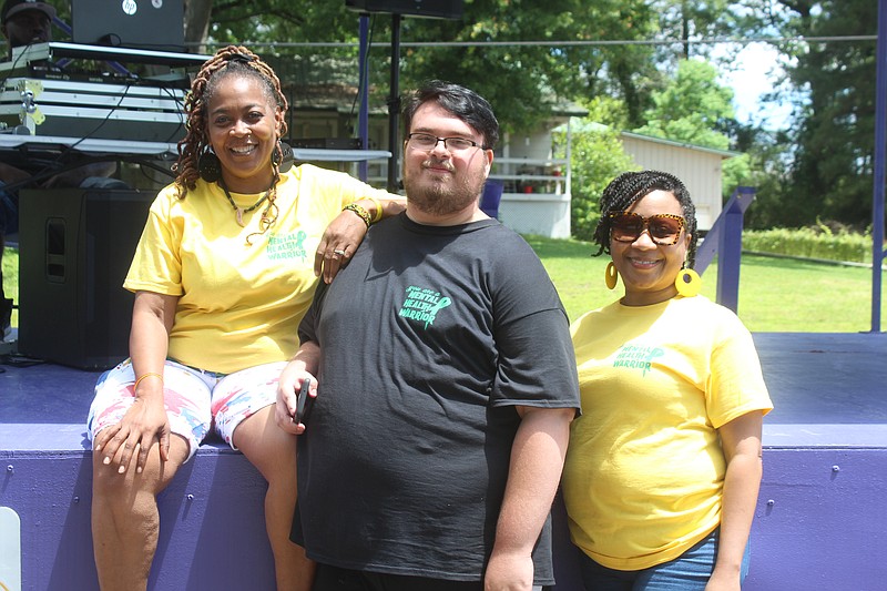 “Awareness Angels” Sharon Davis and Samuel Hux, joined here by El Dorado Mayor Veronica Smith-Creer, organized Saturday’s mental health awareness and Stop the Violence event at Old City Park. (Matt Hutcheson/News-Times)