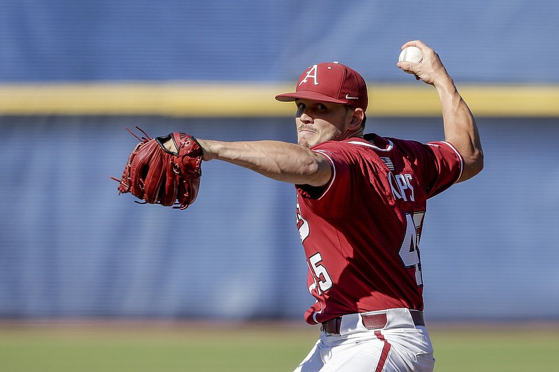 Arkansas pitcher Kevin Kopps pitches against Tennessee in the ninth inning of an NCAA college baseball championship game during the Southeastern Conference tournament Sunday, May 30, 2021, in Hoover, Ala. (AP Photo/Butch Dill)