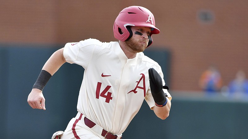 Arkansas baserunner Cullen Smith (14) runs to third base against Memphis during an NCAA baseball game on Wednesday, March 24, 2021, in Fayetteville, Ark. (AP Photo/Michael Woods)