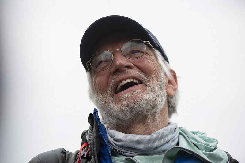 American climber Arthur Muir, 75, gestures as he arrives in Kathmandu, Nepal, Sunday, May 30, 2021. The retired attorney from Chicago who became the oldest American to scale Mount Everest, and a Hong Kong teacher who is now the fastest female climber of the world’s highest peak, on Sunday returned safely from the mountain where climbing teams have been struggling with bad weather and a coronavirus outbreak. Arthur Muir, 75, scaled the peak earlier this month, beating the record by another American, Bill Burke, at age 67. (AP Photo/Bikram Rai)
