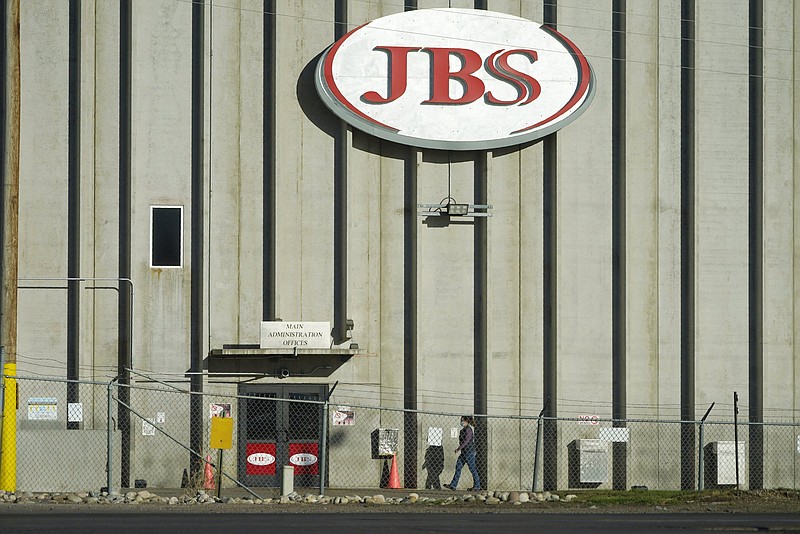 A worker enters the JBS meatpacking plant in Greeley, Colo., last fall. A weekend ransomware attack on the world’s largest meat  company has disrupted production around the world.
(AP)
