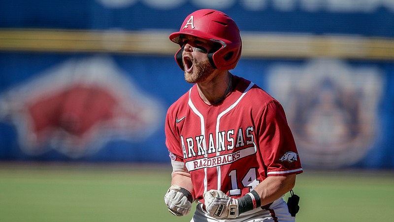 Arkansas’ Cullen Smith celebrates after hitting a two-run home run against Tennessee in the eighth inning of an NCAA college baseball championship game during the Southeastern Conference tournament Sunday, May 30, in Hoover, Ala (AP Photo/Butch Dill)