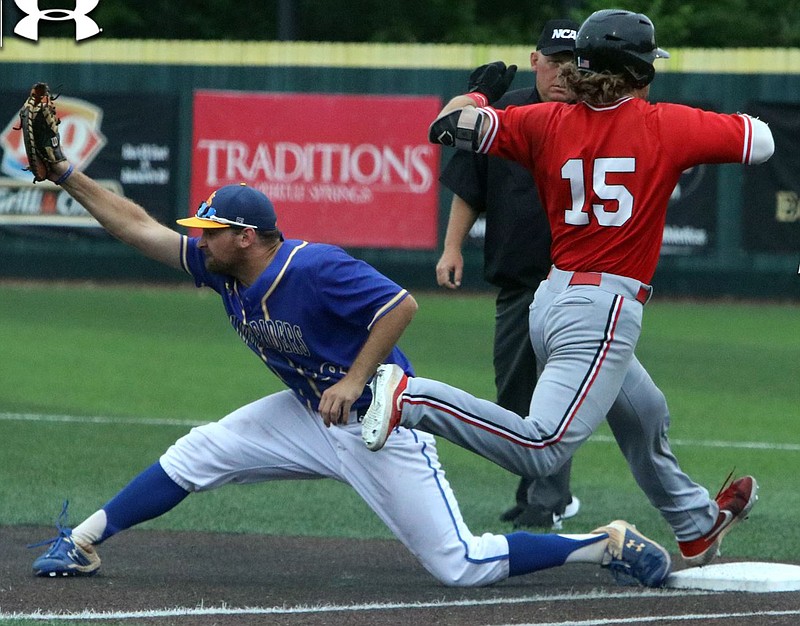 An official watches the play closely at first as SAU’s Mason Peterson catches the ball against Central Missouri, who defeated the Muleriders 12-5 in the NCAA Division II Central Region Tournament championship round on Monday. (SAU Sports Information)