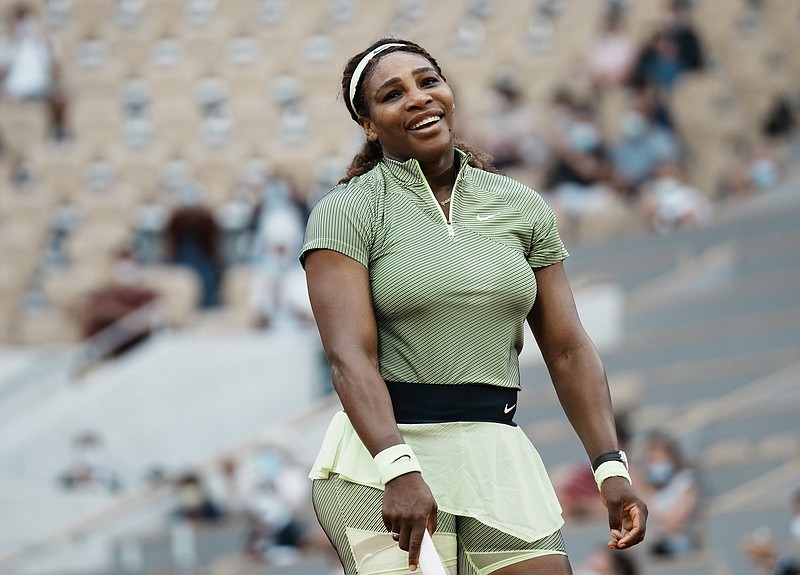United States Serena Williams smiles after missing a point against Romania's Mihaela Buzarnescu during their second round match on day four of the French Open tennis tournament at Roland Garros in Paris, France, Wednesday, June 2, 2021. (AP Photo/Thibault Camus)