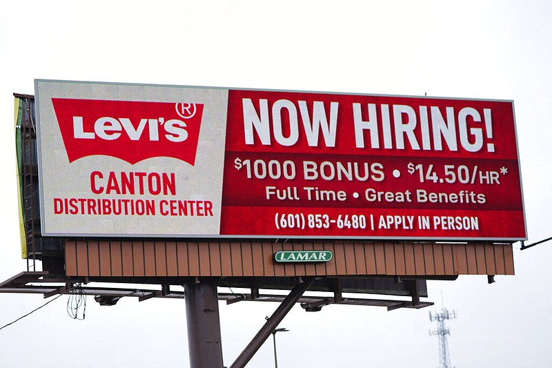 Management at the Levi's Distribution Center in Canton, Miss., are upping the ante by using an electronic display board to advertise openings, a bonus and pay scale on Interstate 55 in northeast Jackson, Miss., in this May 12, 2021, file photo. (AP/Rogelio V. Solis)