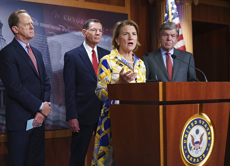 In this photo taken Thursday, May 27, 2021, Sen. Shelley Moore Capito, R-W.Va., the GOP's lead negotiator on a counteroffer to President Joe Biden's infrastructure plan, speaks at a news conference as she is joined by, from left, Sen. Pat Toomey, R-Pa., Sen. John Barrasso, R-Wyo., chairman of the Senate Republican Conference, and Sen. Roy Blunt, R-Mo., at the Capitol in Washington. (AP/J. Scott Applewhite)