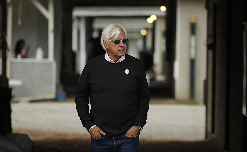 Trainer Bob Baffert looks out from his barn before a workout at Churchill Downs in Louisville, Ky. Baffert was suspended for two years by Churchill Downs on Wednesday, after an additional drug test of Medina Spirit confirmed the presence of the steroid betamethasone in the Kentucky Derby winner’s system. (Associated Press)
