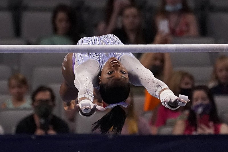 Simone Biles, the reigning Olympic and world champion, posted a total score of 59.550 at the U.S. Gymnastics Championships on Friday, all but assuring her of a seventh national title.
(AP/Tony Gutierrez)