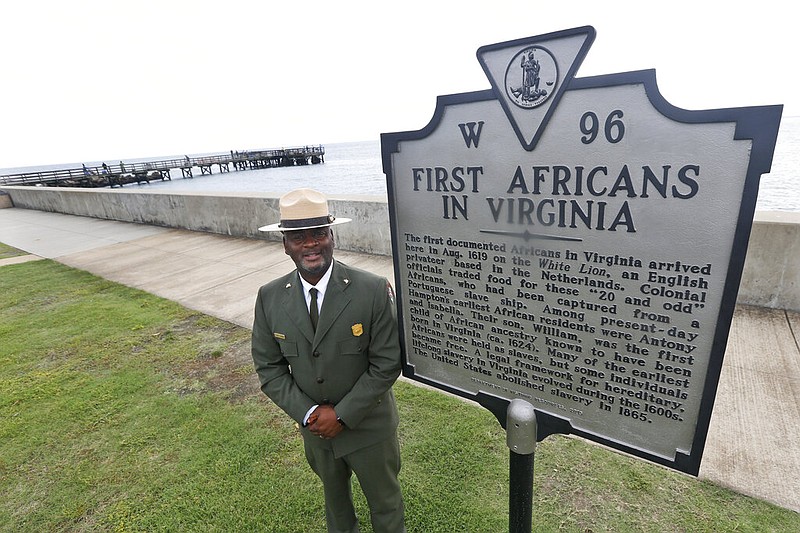 Terry E. Brown, superintendent of the Fort Monroe National Monument in Hampton, Va., poses next to a historical marker at Fort Monroe in this Aug. 15, 2019, feil photo. The marker signifies the spot of the first landing of Africans in America in 1619. Various groups, including the 400 Years of African American History Commission, have held events to mark four centuries of Blacks in the territory that is now the United States. (AP/Steve Helber)